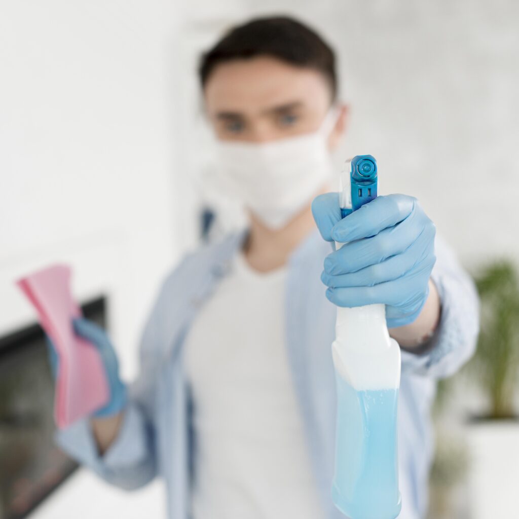 defocused-man-with-face-mask-holding-ablution